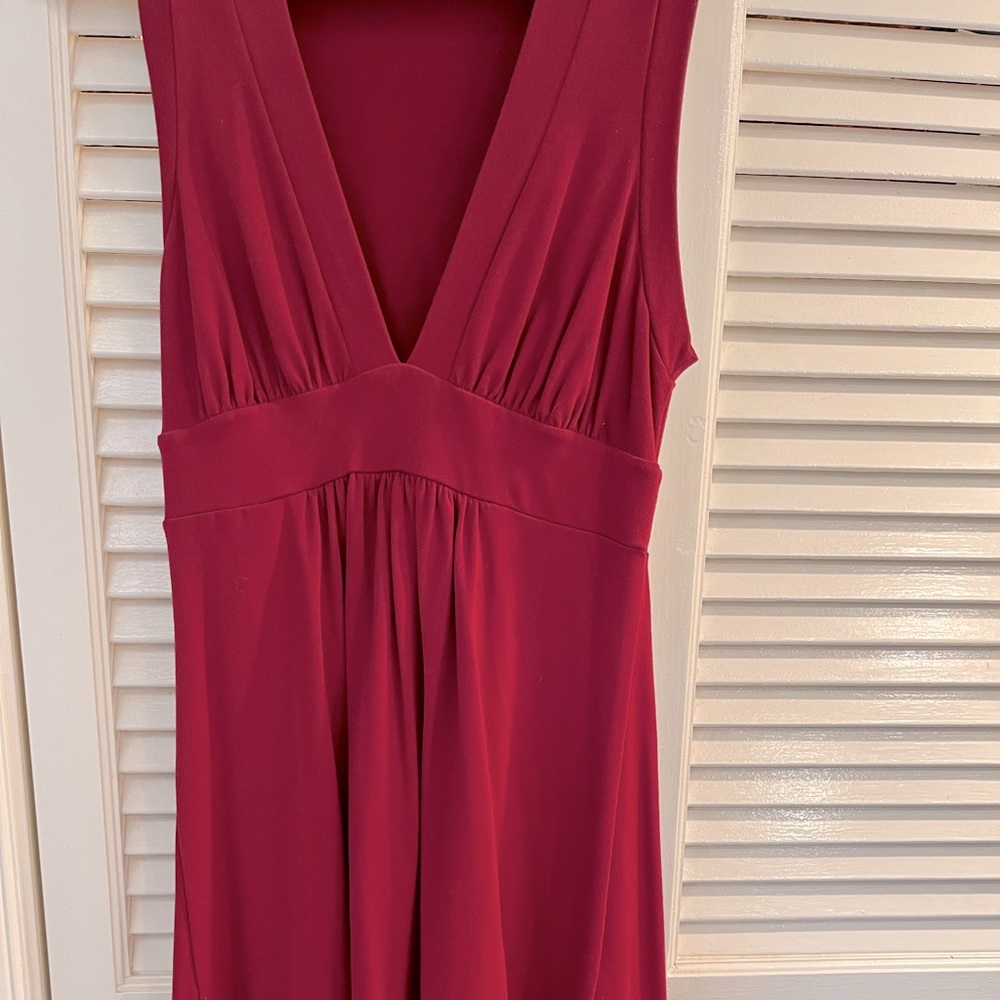 Red A-line sleeveless dress.